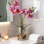Faux purple orchids in a glass vase - Image 3