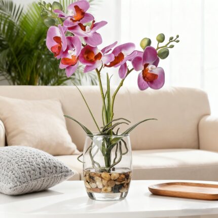 Faux purple orchids in a glass vase
